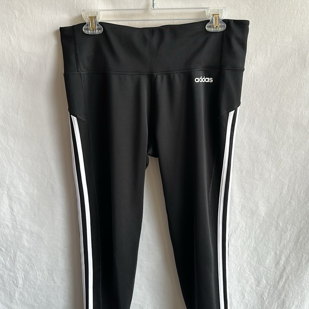 Adidas black exercise leggings with white stripes, size L